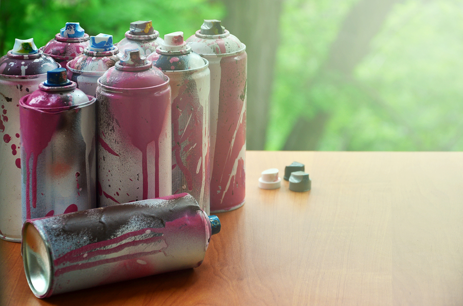 A Lot Of Used Spray Cans Of Paint Close-up