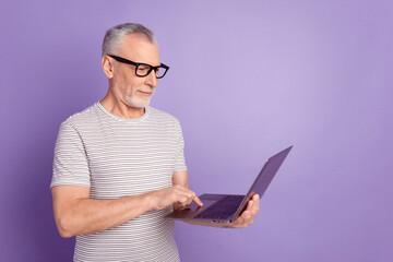 middle-aged man holding a laptop