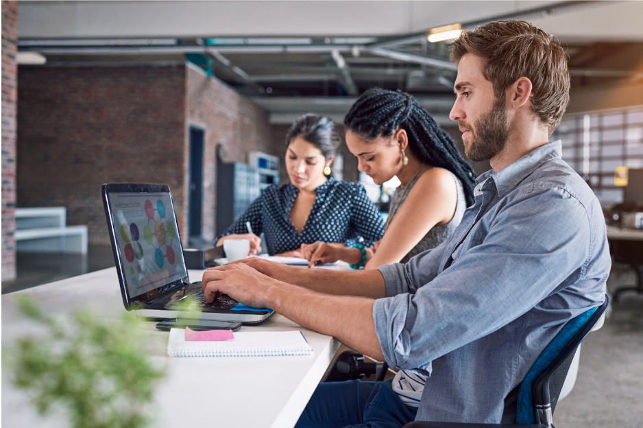 man and two women working