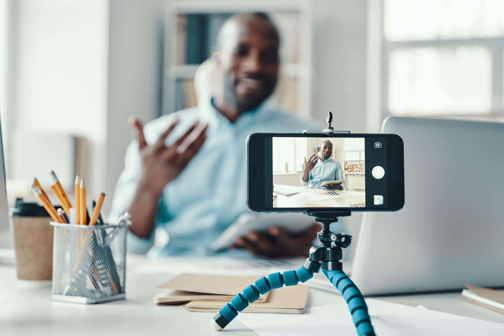 man filming himself on his phone