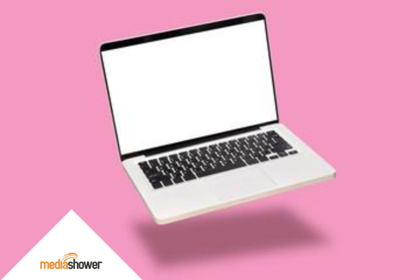 laptop with a pink background