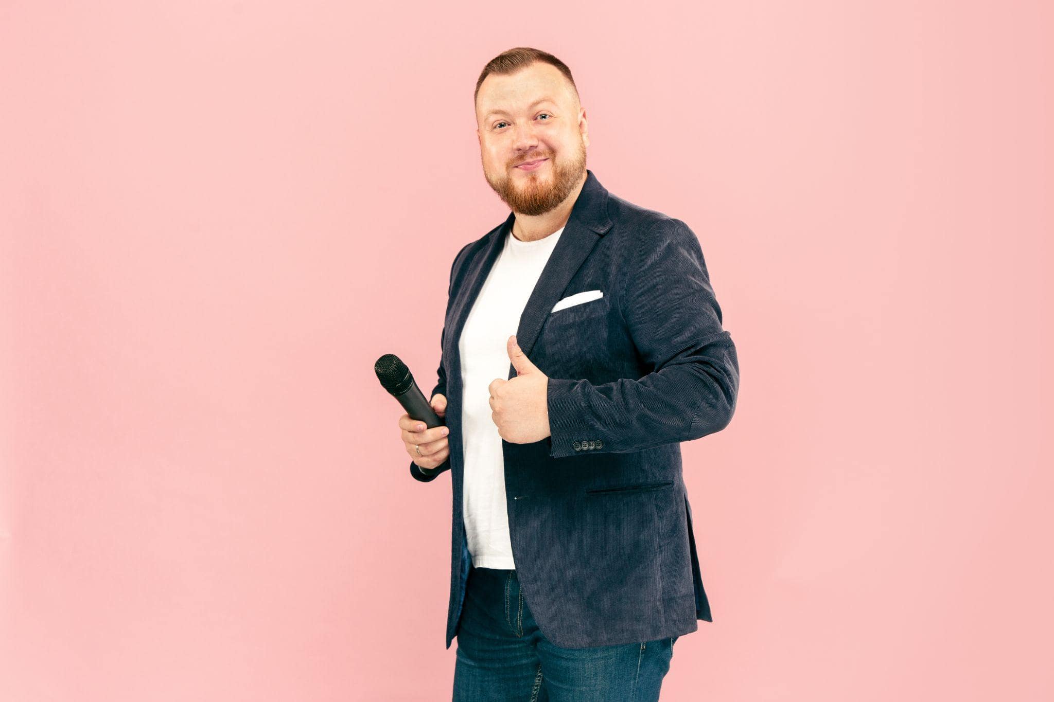 Man in a suit giving thumbs up