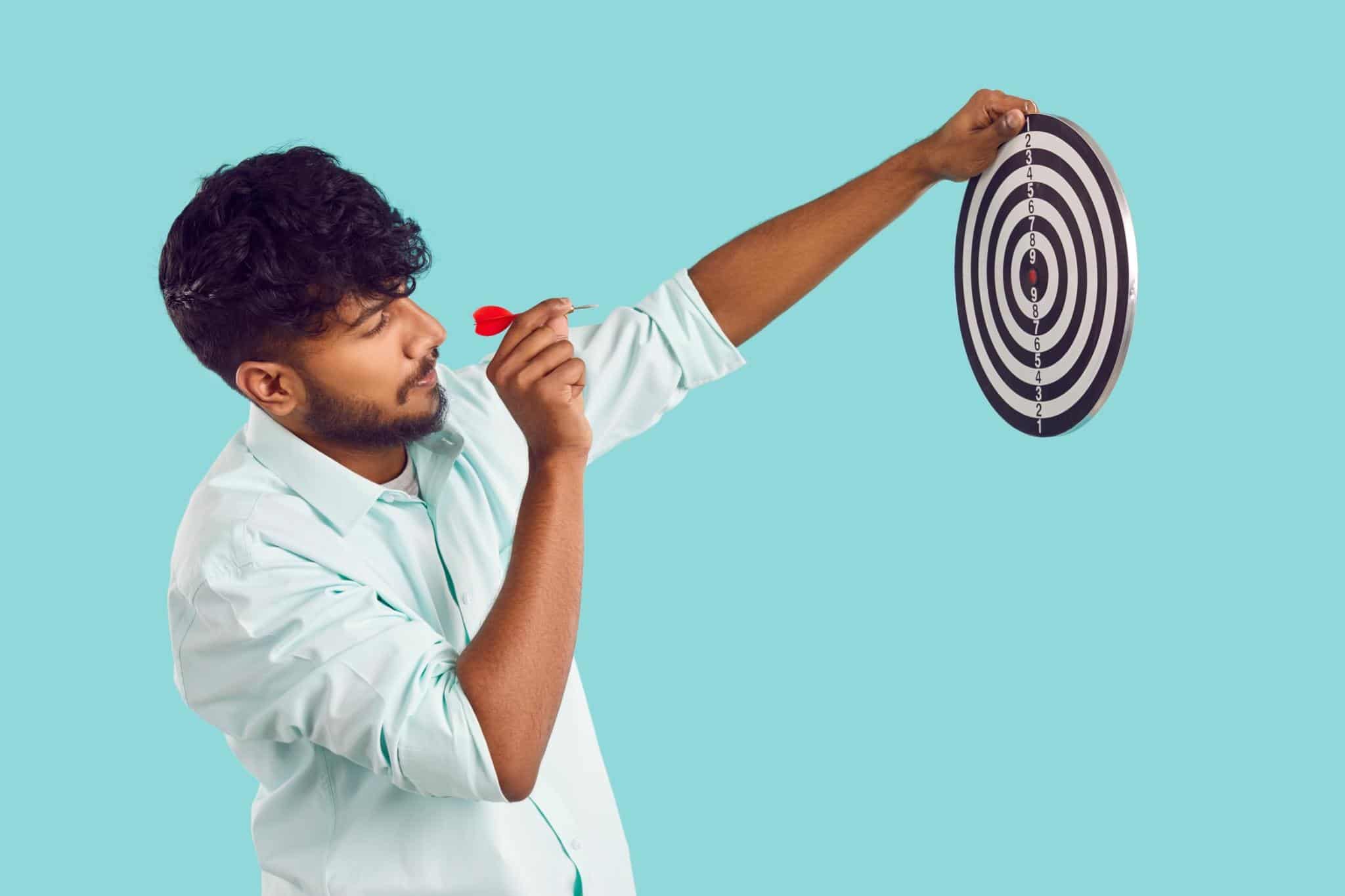 man throwing a dart