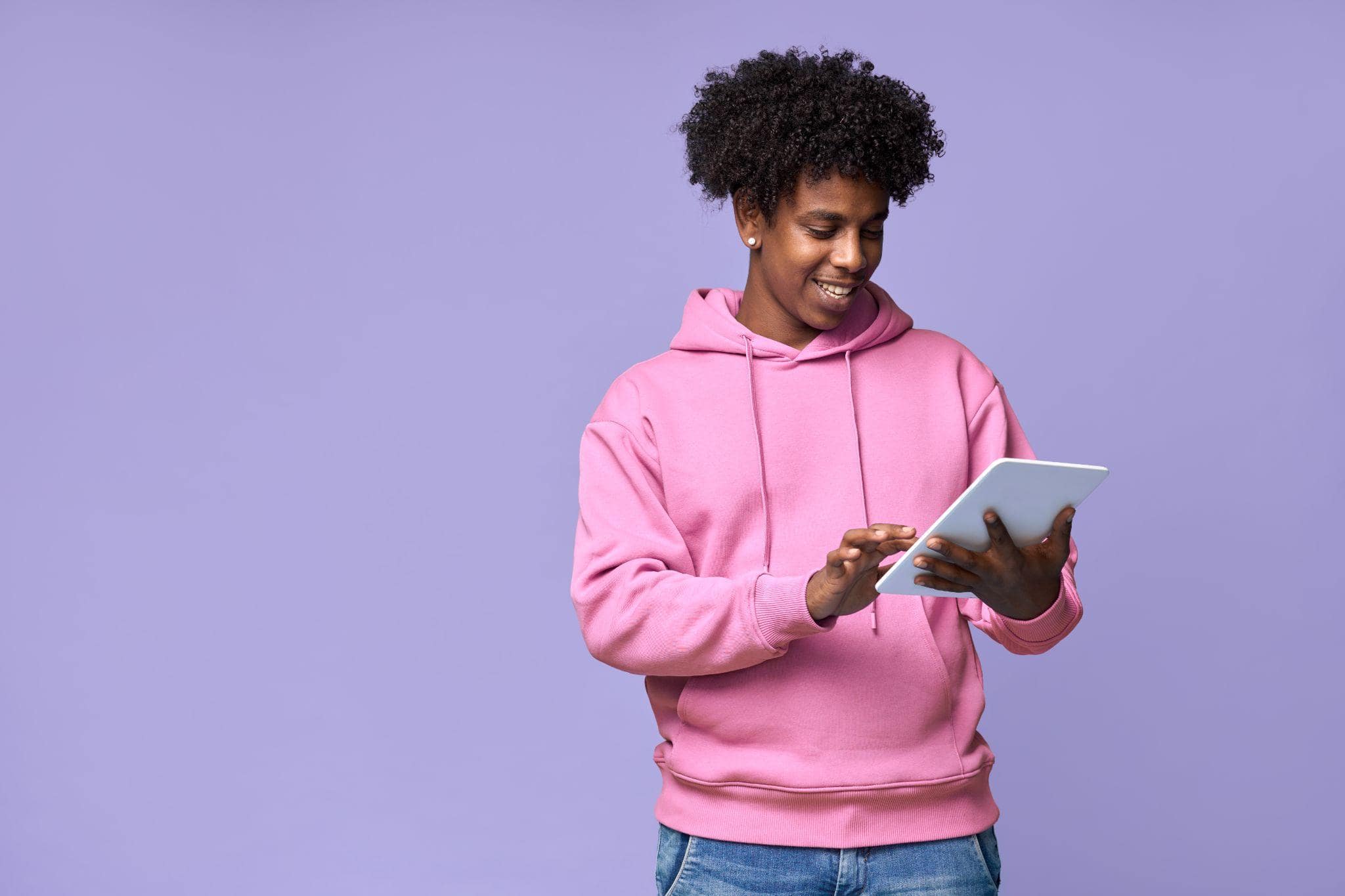 young black man checking his tablet