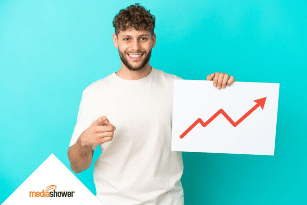 guy holding a graph and smiling