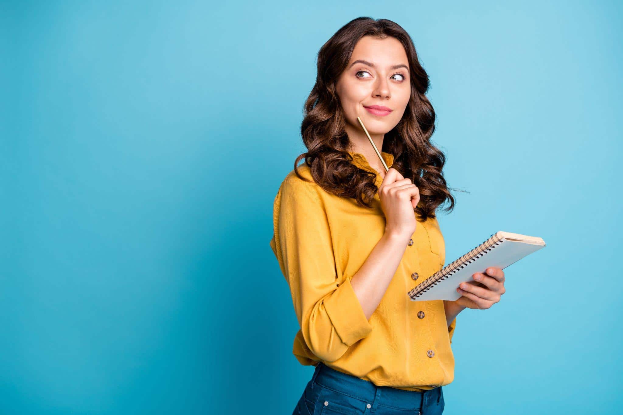 woman taking notes in a notebook