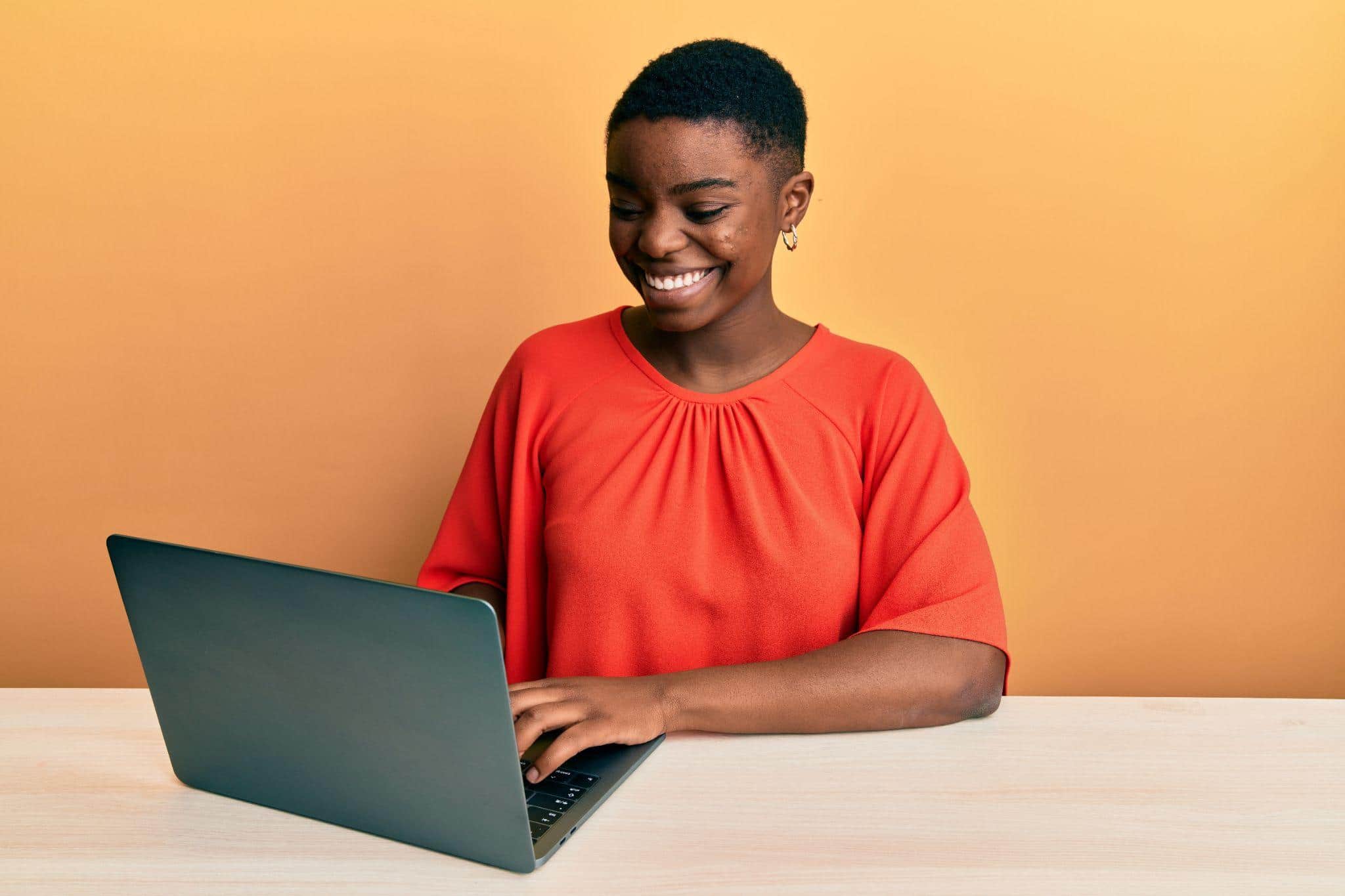 young woman working on a laptop