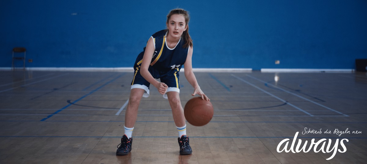 girl playing basketball - marketing by always