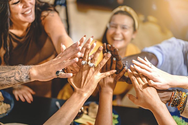 people joining hands together