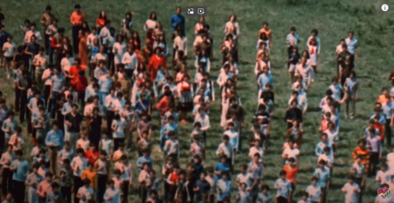 many people standing in a field