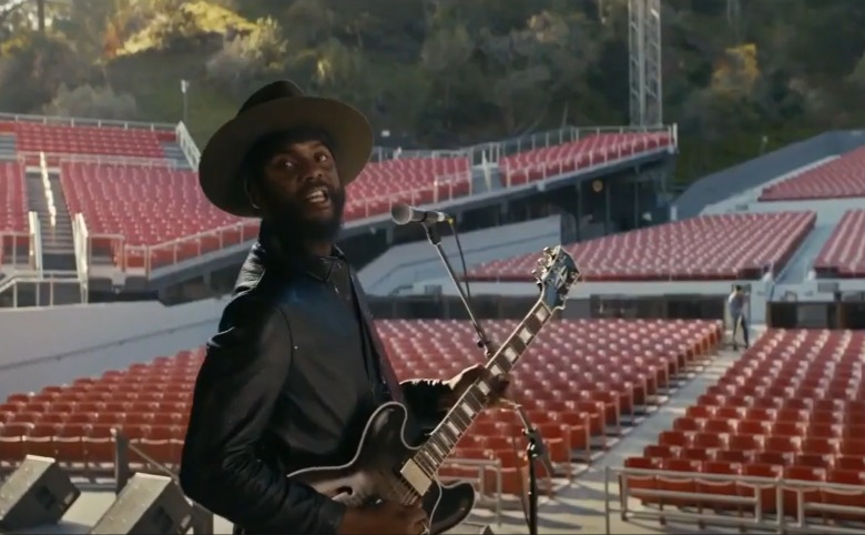 young black rock star rehearsing on stage for a concert