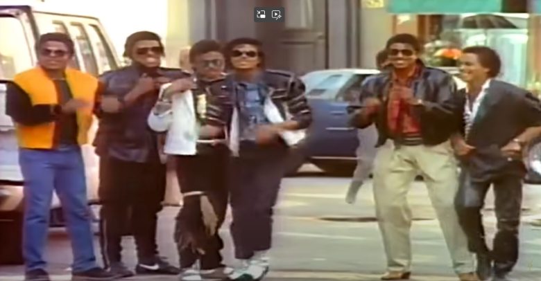 michael jackson dancing in the street with people in the background