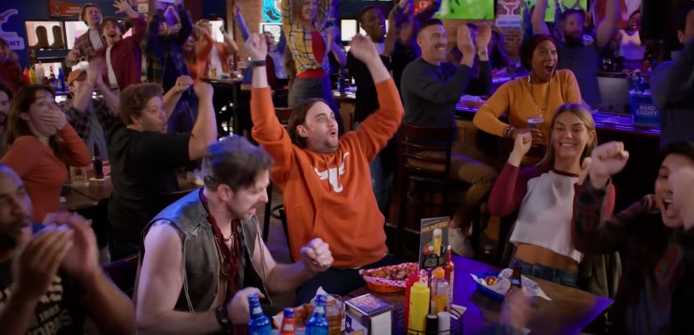 people cheering in a bar