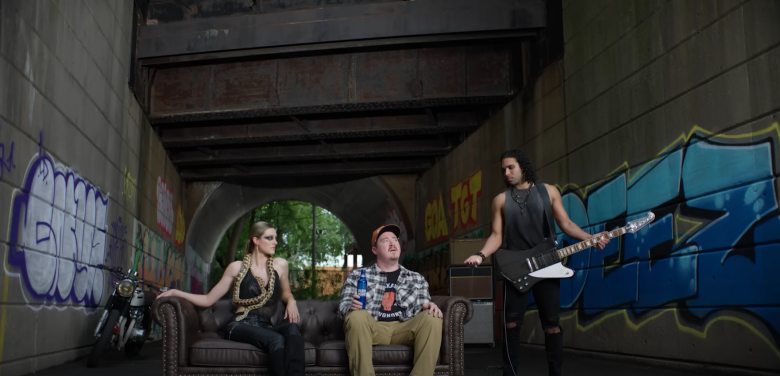 three people hanging out under a bridge in part of a Bud Light commercial