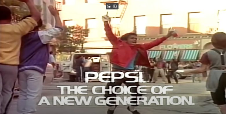 young black boy in a red jacket in a pepsi commercial