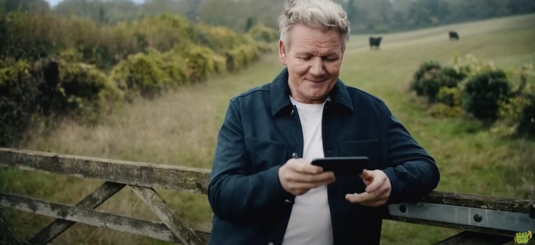 gordon ramsay in a field with a phone