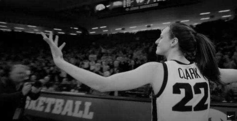 female basketball player on the court celebrating a shot