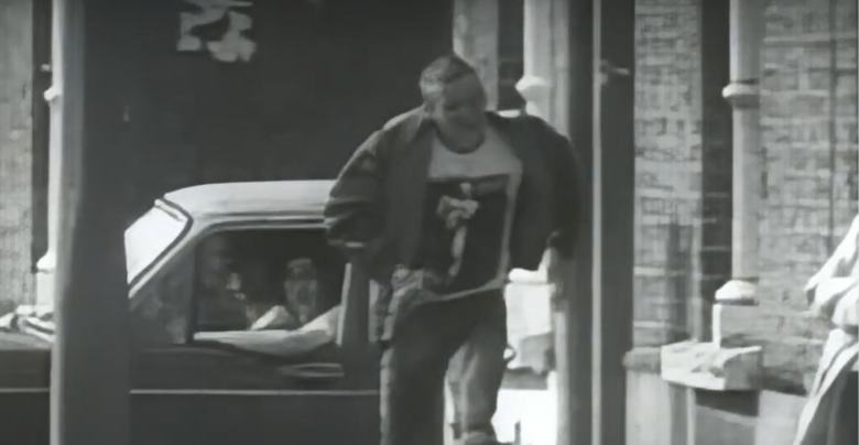 young man running on a sidewalk in the city