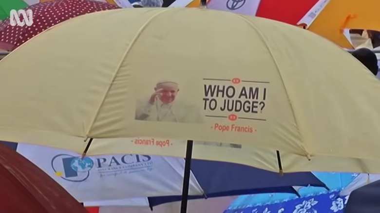umbrella with the quote Who Am I to Judge? by Pope Francis