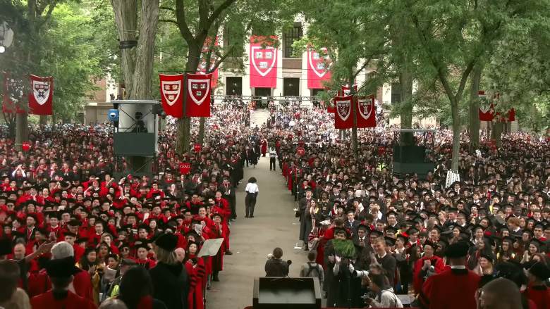 crowd of graduates at Harvard awaiting the speeches
