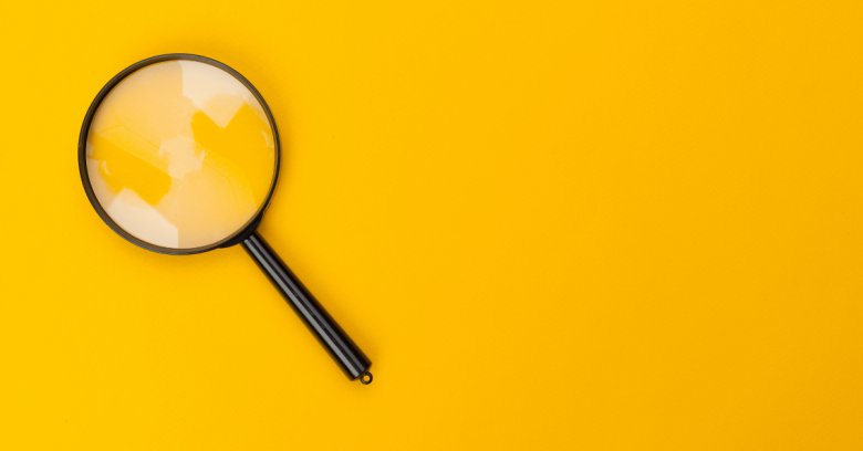 a magnifying glass in a yellow background