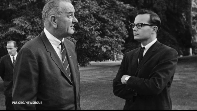 black and white photo of Bill Moyers with LBJ