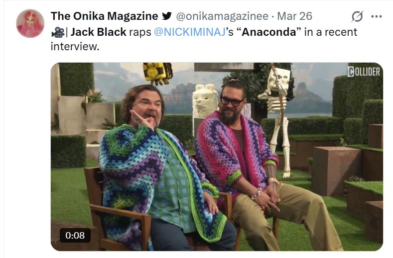 Jack Black and Jason Momoa wearing colorful ponchos and smiling