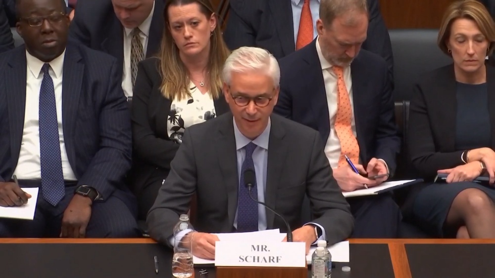 Mr. Scharf speaking at a formal hearing
