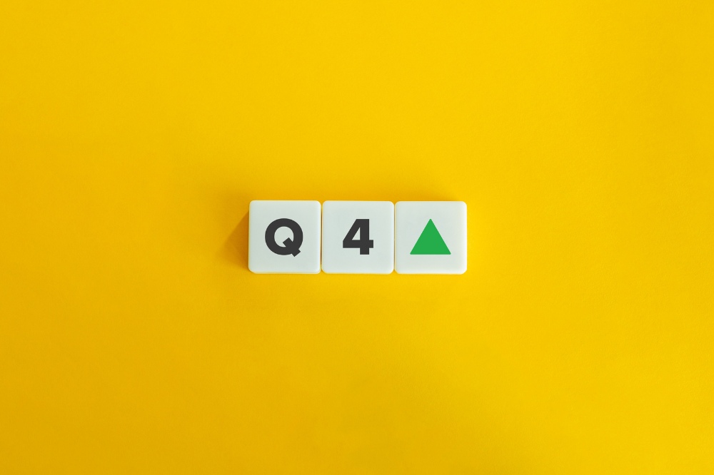 Q4 with upward arrow on yellow background