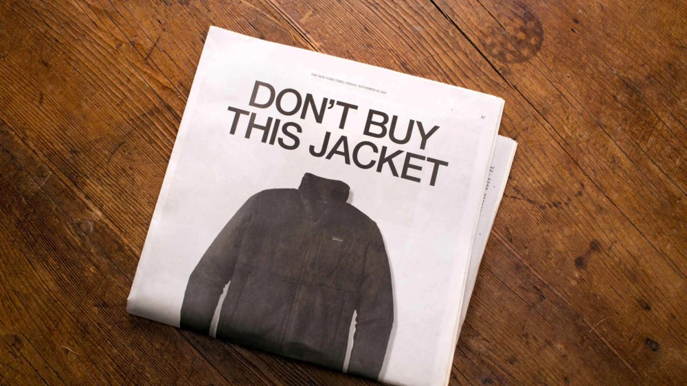 Patagonia 'Don't Buy This Jacket' NYT ad on wooden table