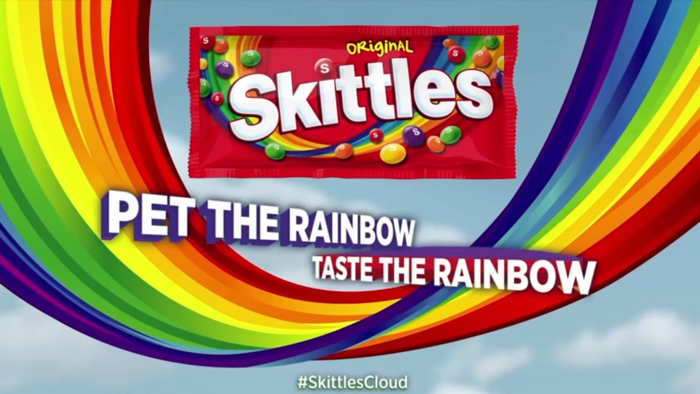 Skittles Original candy pack with rainbow and text Pet the Rainbow Taste the Rainbow