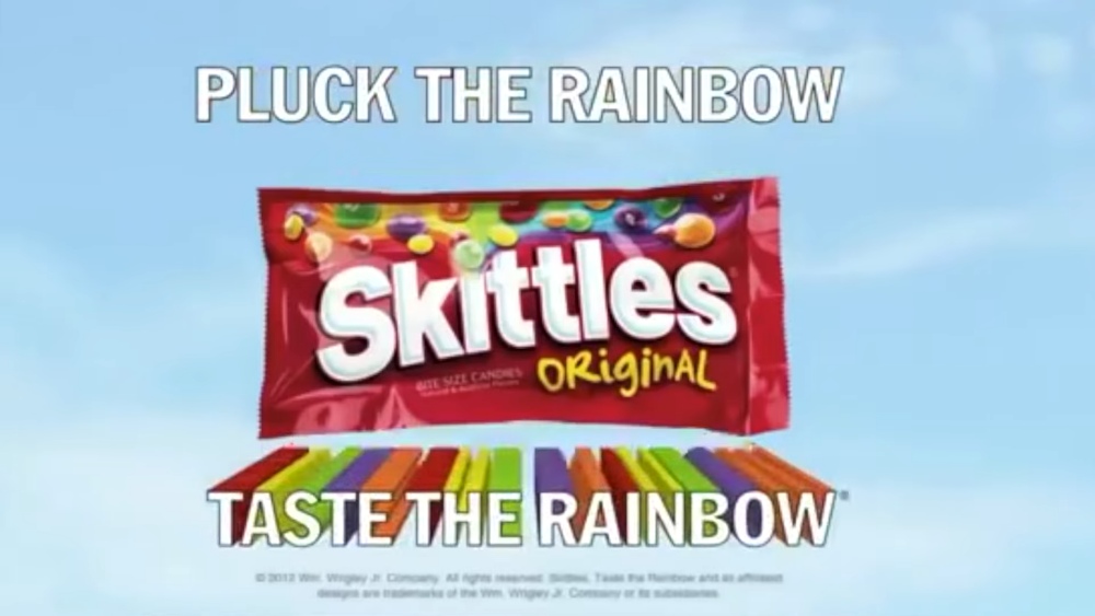 Skittles Original candy pack with text Pluck the Rainbow Taste the Rainbow