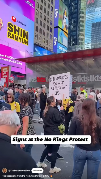 Crowd at No Kings Protest in Times Square with sign 'Billionaire$ Do Not Represent Us!