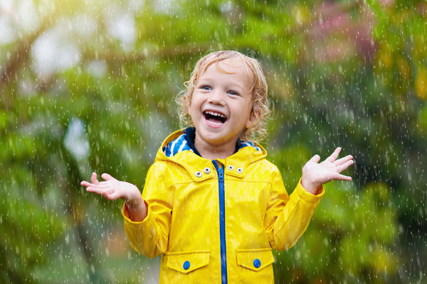 Child laughing in the rain.
