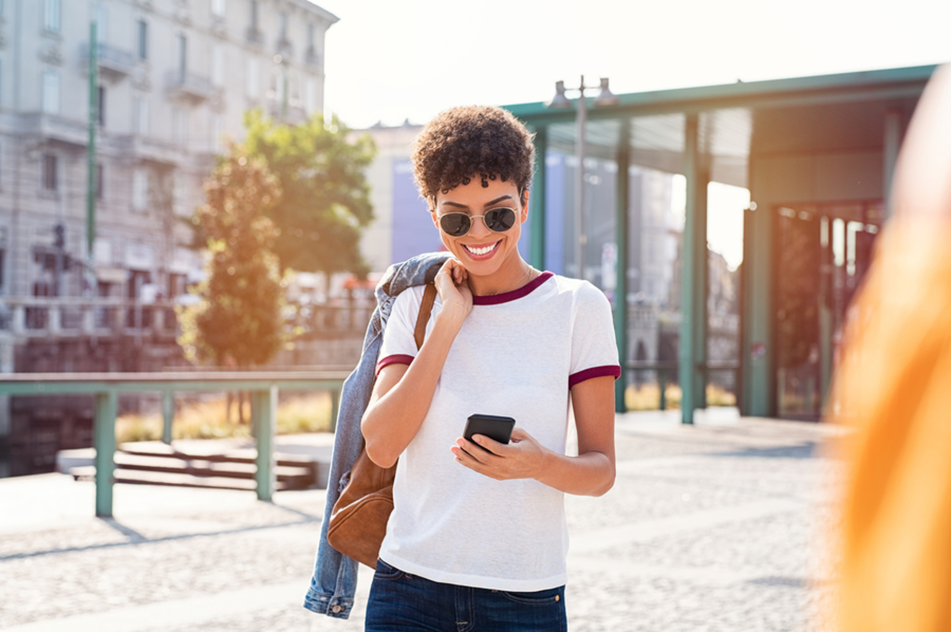 Smiling woman looking at her phone. Smiling woman looking at her phone.
