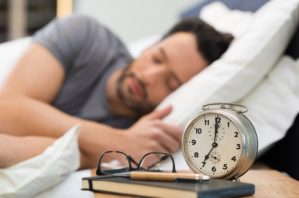 For Video Ads, the Time of Day Matters with Man sleeping and alarm clock