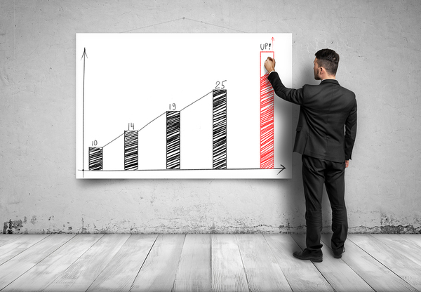 Man in Front of Return on Investment Graph for Video Marketing Campaigns