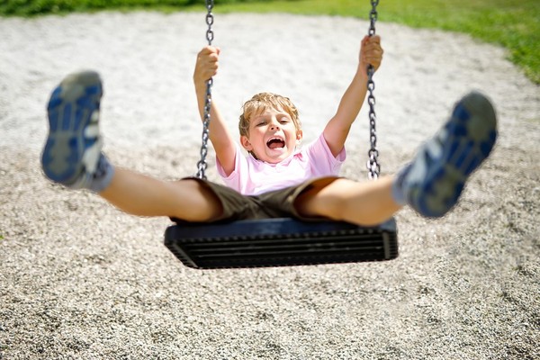 Child swinging.