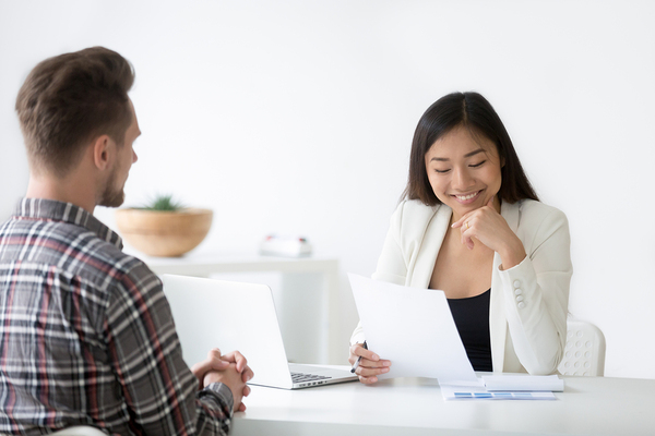 Woman conducting an interview with a job candidate.