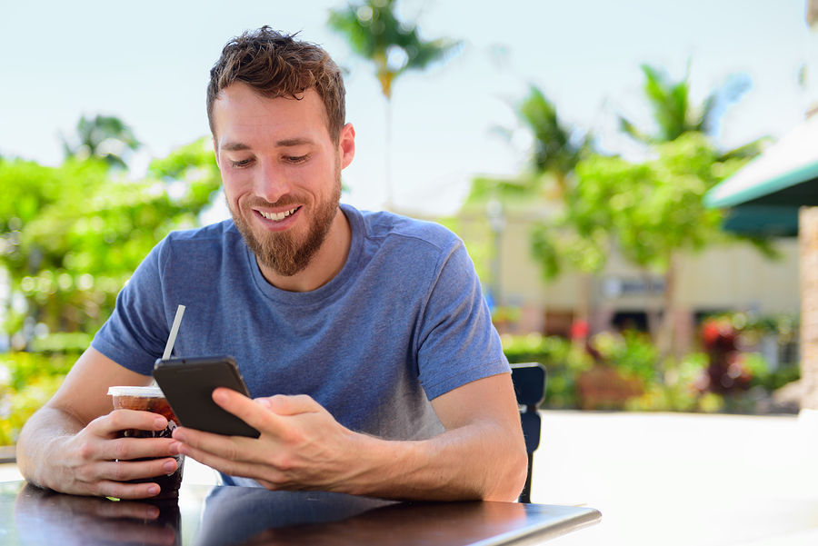 man using mobile smartphone with marketing company website design and build