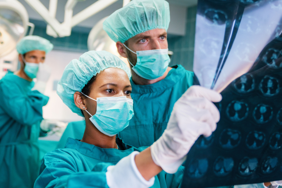 Medical doctors looking at exam results.