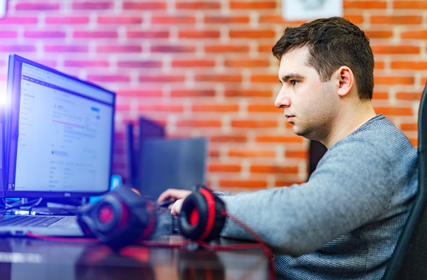 Typing on a desktop computer keyboard.