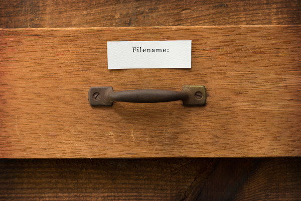 Wooden drawer labeled Filename: