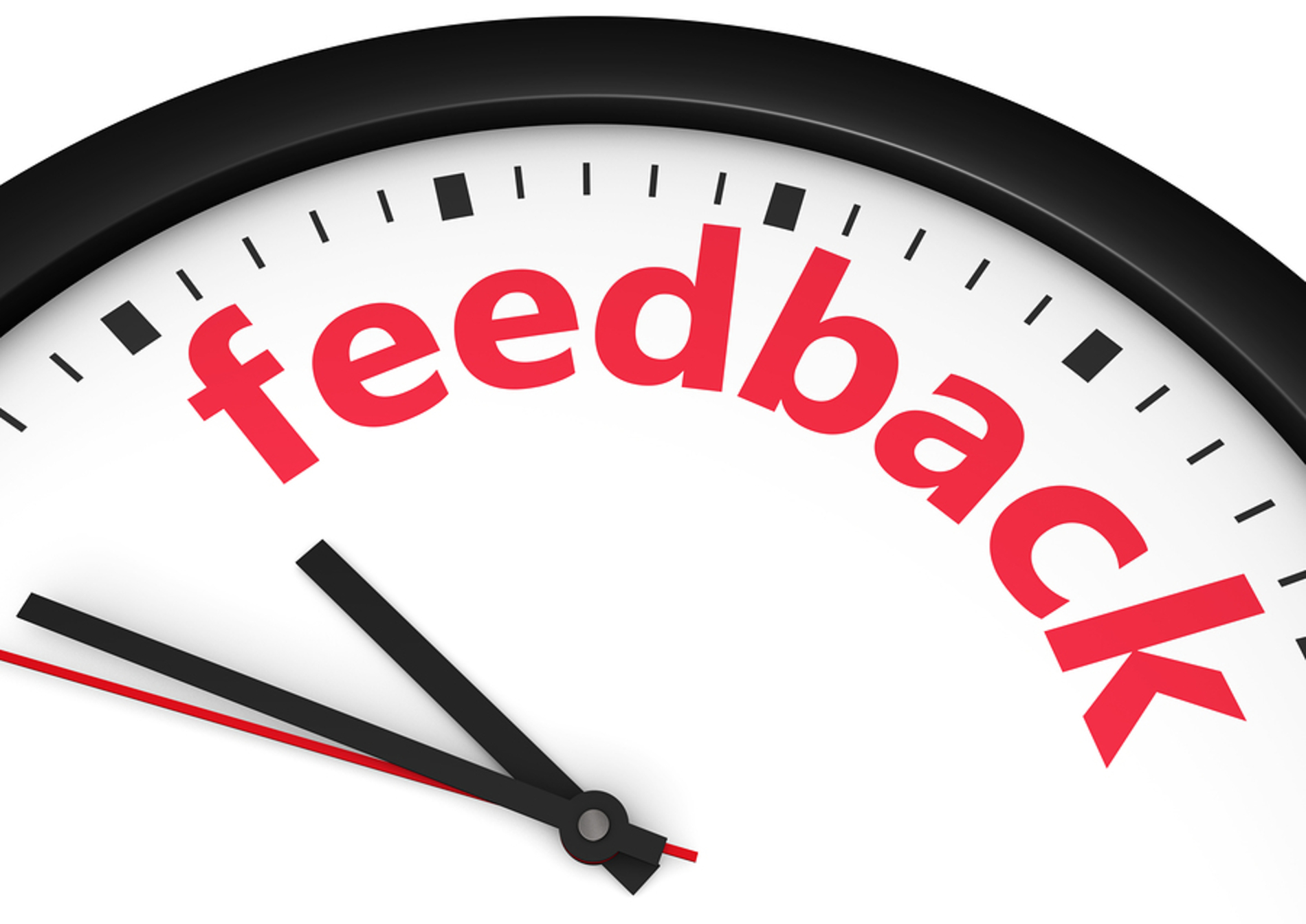 Clock with the words feedback in red.