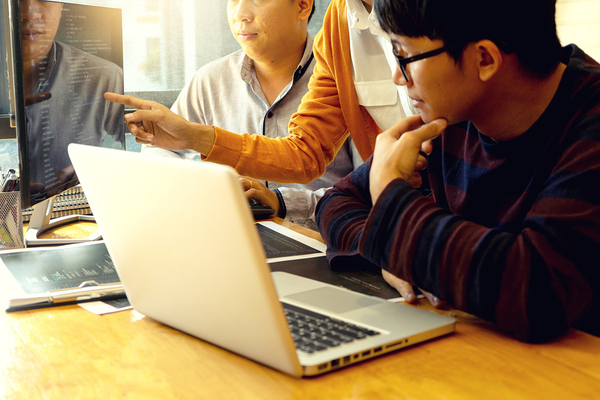 Three developers discussing a project.