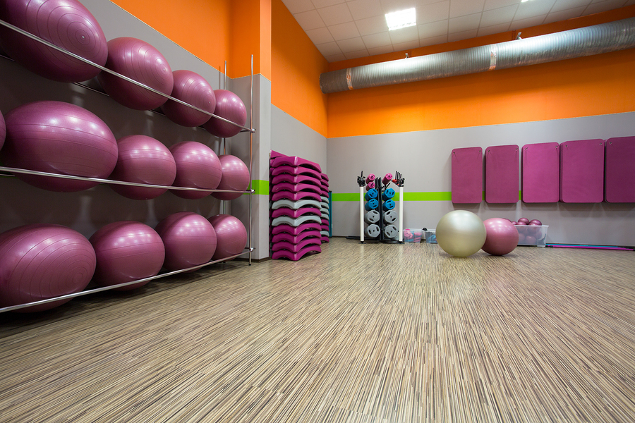  fitness center group fitness room with exercise balls, floor mats and weights