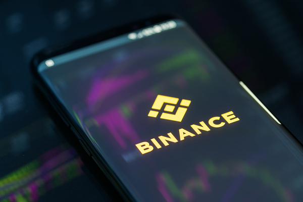 Binance logo displayed on a phone.