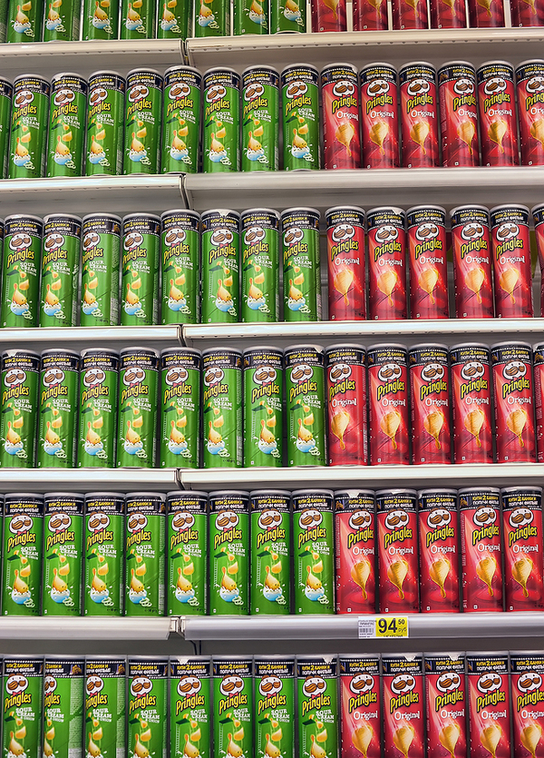 Shelves filled with Pringles.