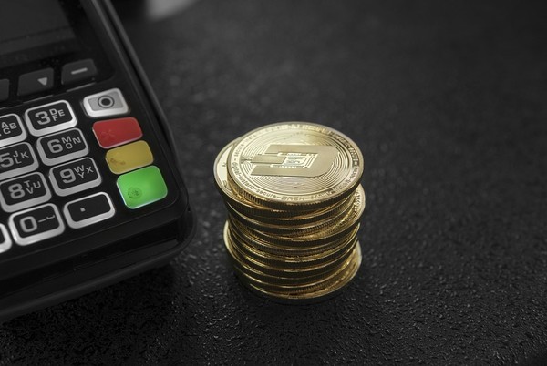 Stack of gold coins with Dash symbol.