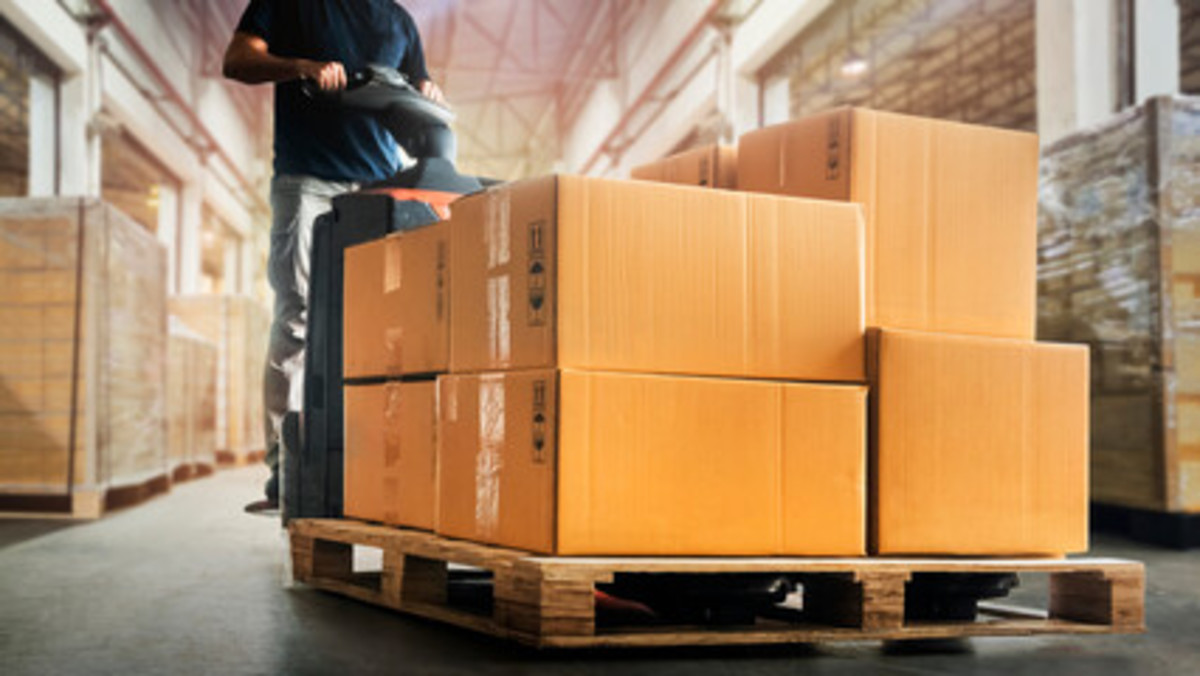 Moving boxes in a warehouse.